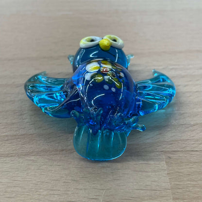Blue art glass owl figurine — top view of the swirled glass body