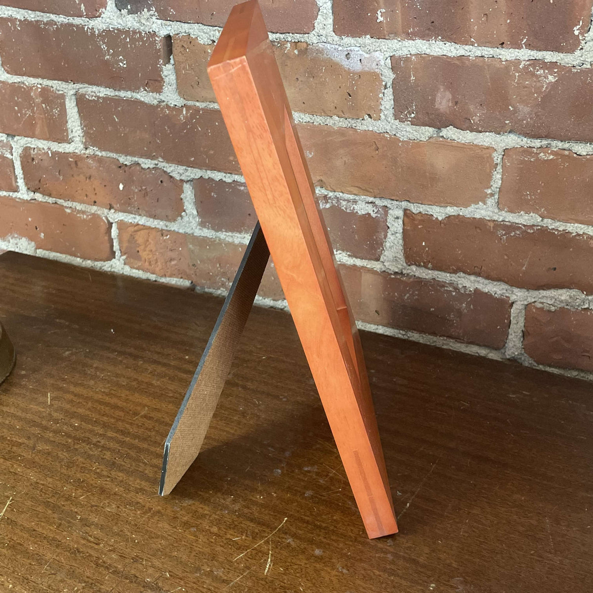 Stained wood frame side view, easel open
