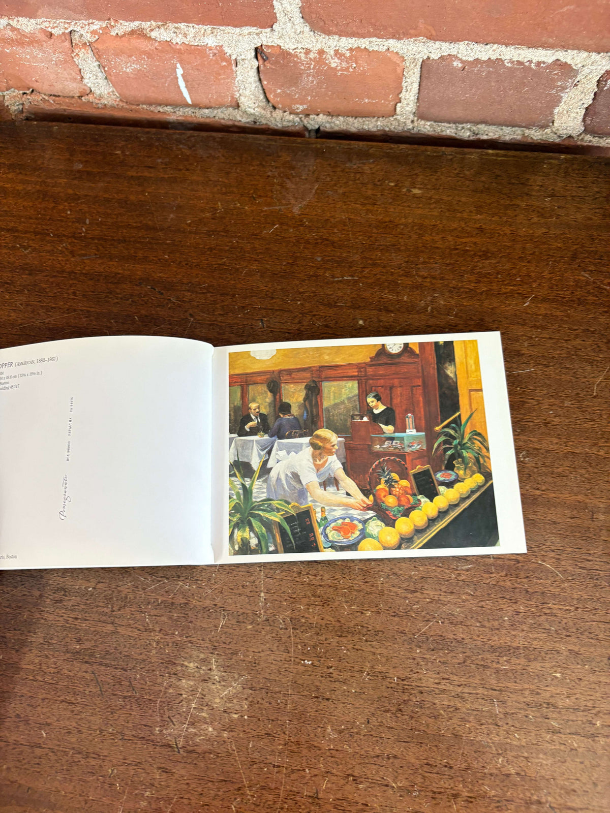 Edward Hopper book open showing a Hopper painting