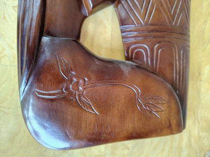 Carved wood wall art — detail of the carved figure