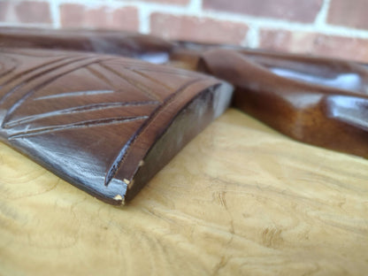 Carved wood wall art — side profile showing relief thickness