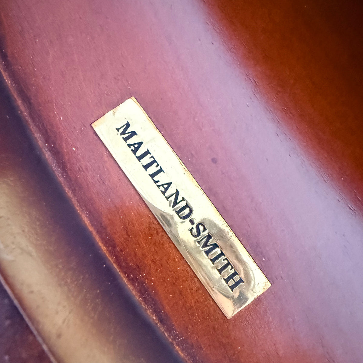Maitland-Smith brass maker's label on the commode