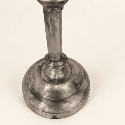 Base and faceted column of a single tarnished Anthropologie candlestick