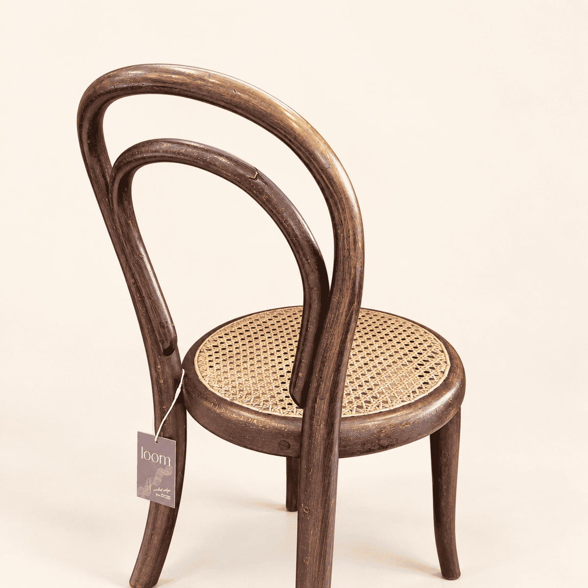 Antique child's caned chair three-quarter view