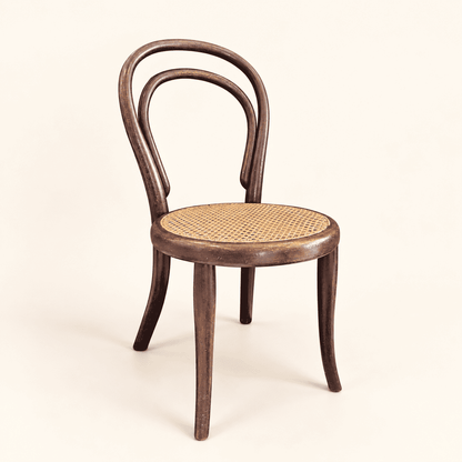 Antique bentwood child's chair with hand-woven cane seat