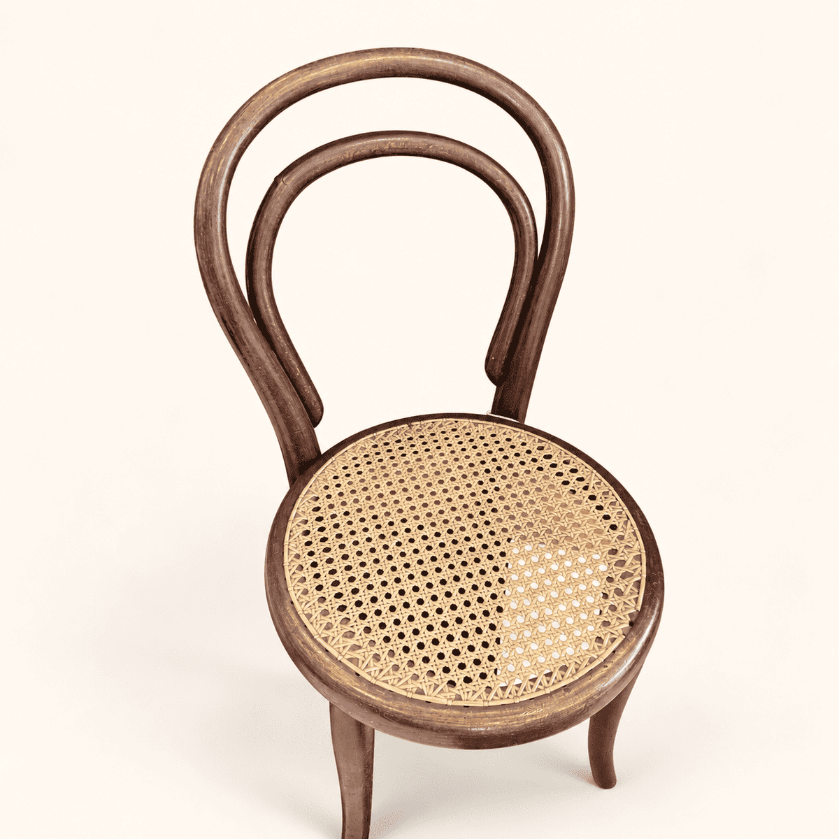 Round hand-woven cane seat on antique child's chair