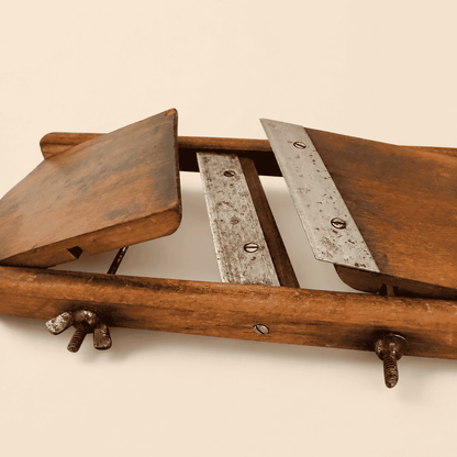 Full front view of the antique cabbage slicer with both blades