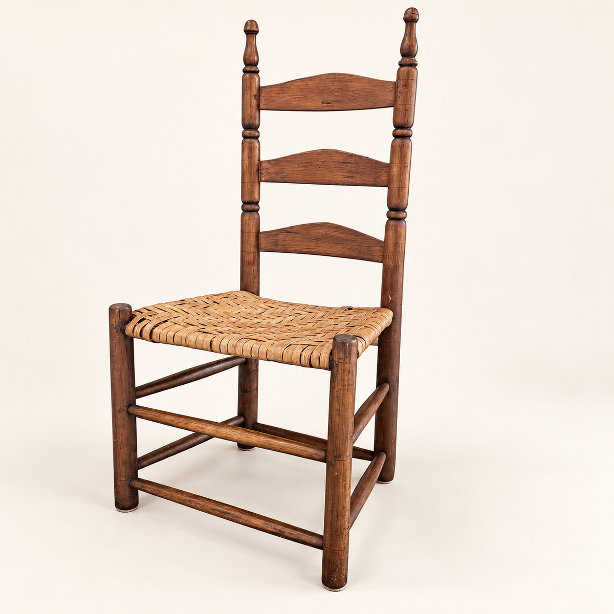 Antique ladder-back side chair with hand-woven splint seat and turned posts