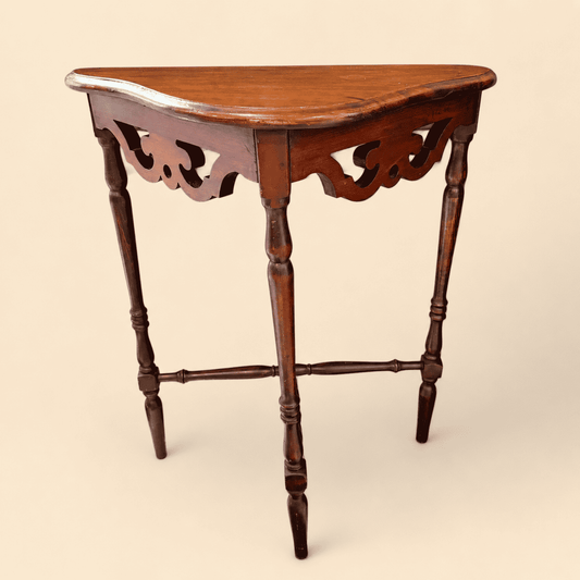 Antique mahogany demilune console table with fretwork apron and turned spindle legs, front view