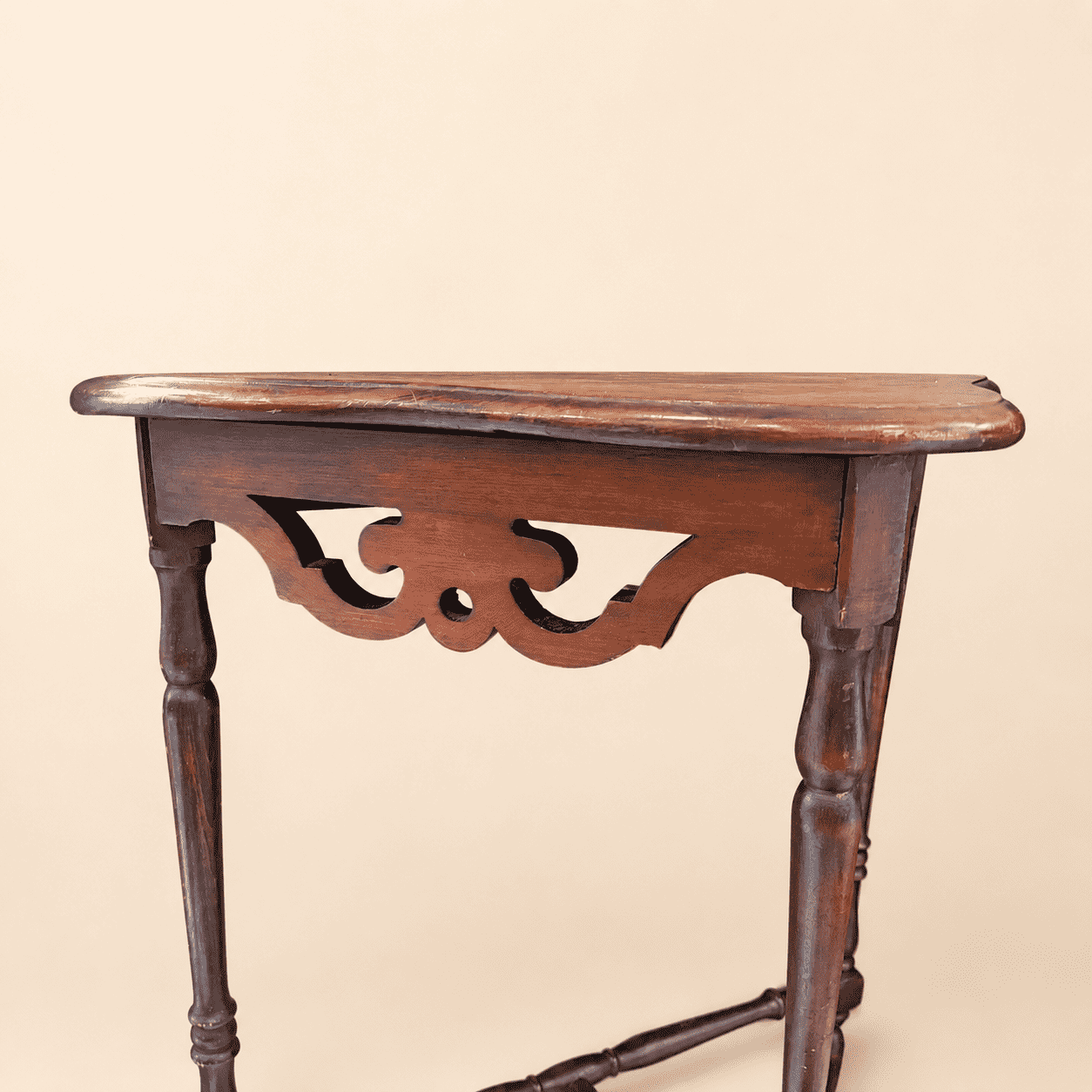 Antique mahogany demilune console table, three-quarter angle view