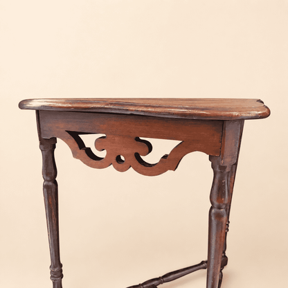 Antique mahogany demilune console table, three-quarter angle view