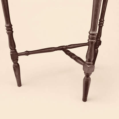 Turned spindle legs and shaped stretcher of the antique demilune console table