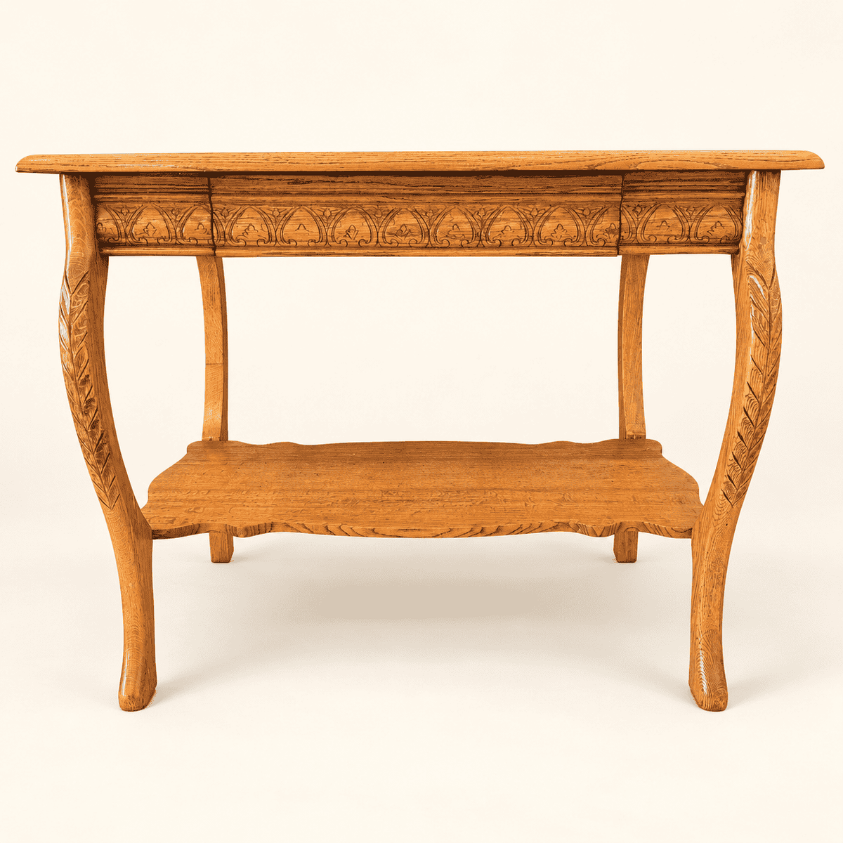Antique quartersawn oak library table with carved apron, cabriole legs and lower shelf, front view