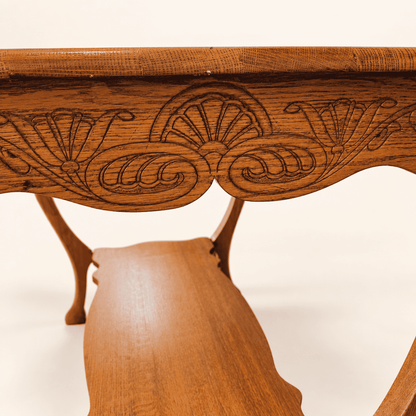Carved fan and scroll apron detail on antique oak library table