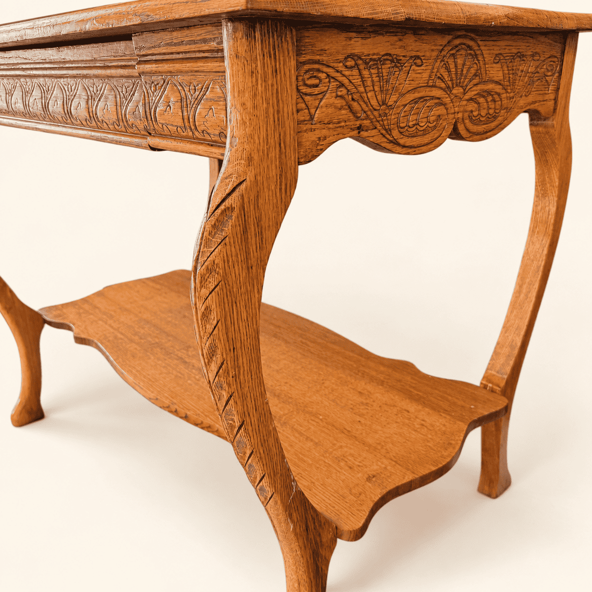 Chip-carved cabriole leg and shaped lower shelf, angled view