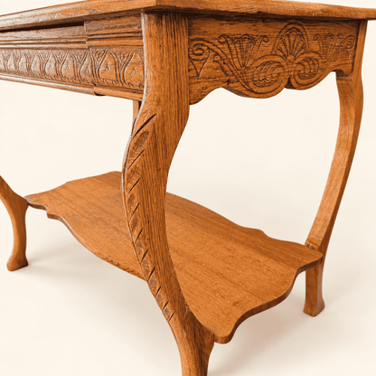 Chip-carved cabriole leg and shaped lower shelf, angled view