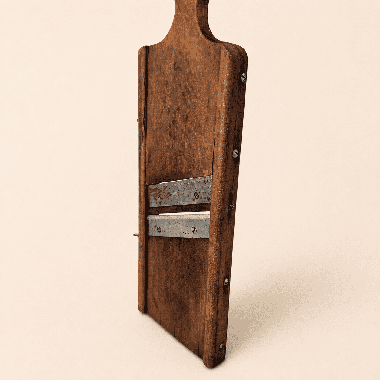 Angled view of the antique wooden kraut slicer