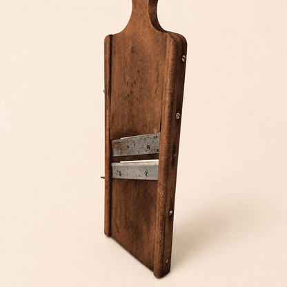 Angled view of the antique wooden kraut slicer