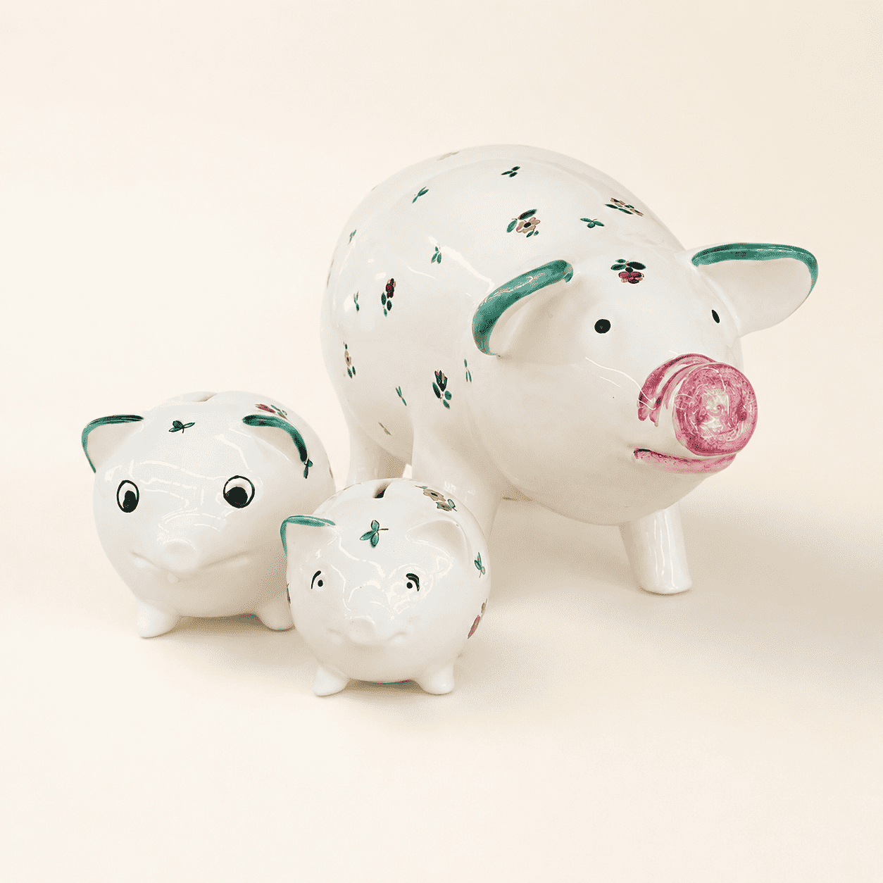 Set of three hand-painted Austrian Streublumen floral piggy banks in graduated sizes, front view