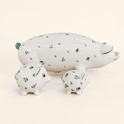 Three hand-painted Streublumen pig banks, large with two small, angled front
