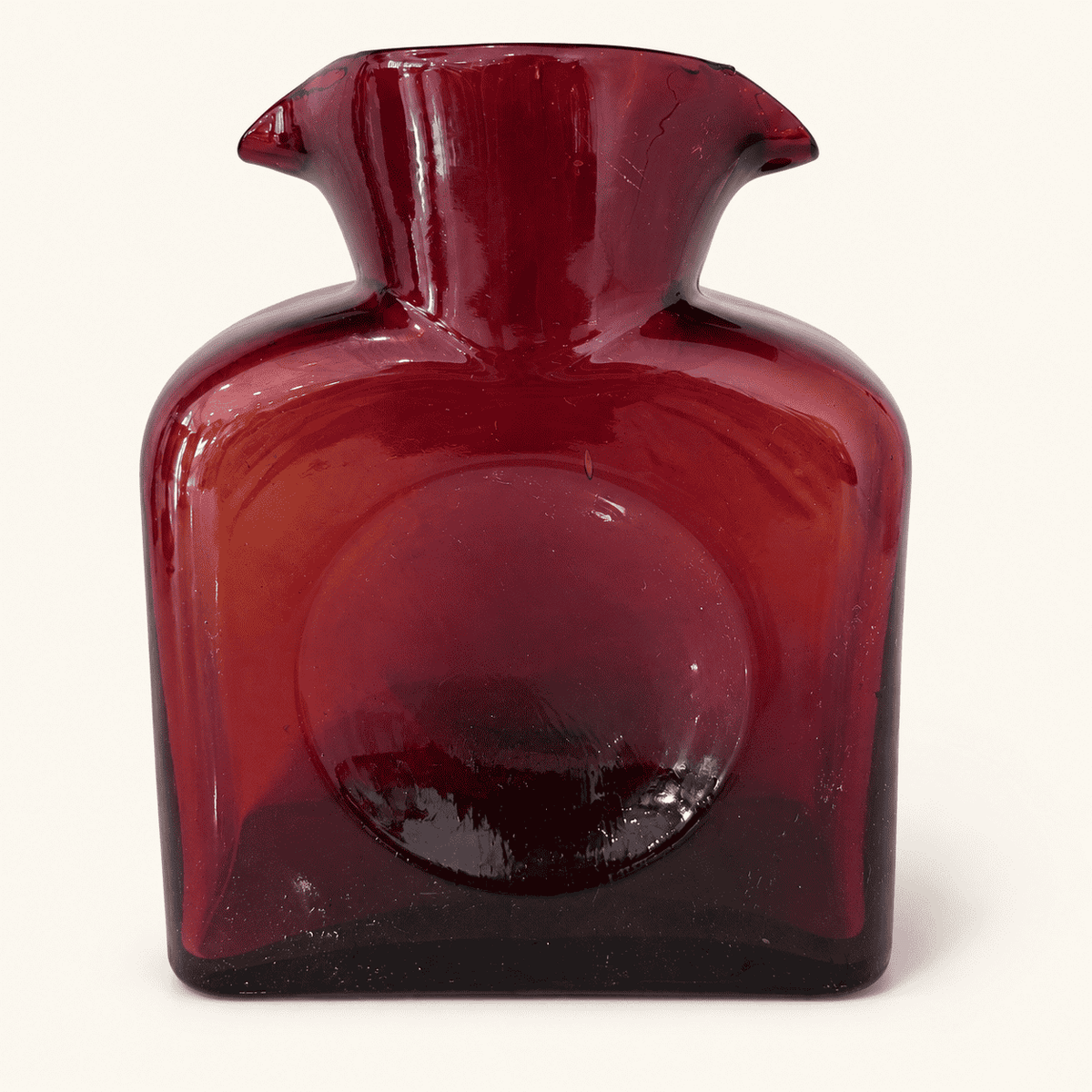 Reverse side of the Blenko 384 ruby water bottle showing the thumb dimple