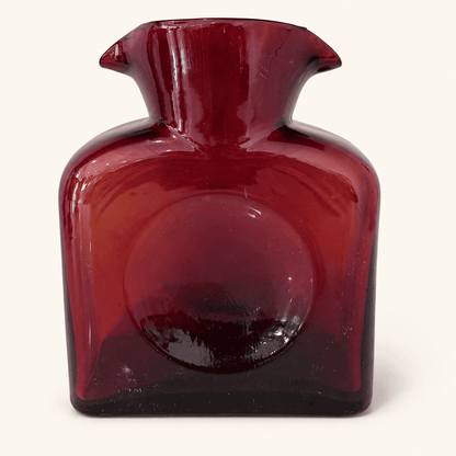Reverse side of the Blenko 384 ruby water bottle showing the thumb dimple