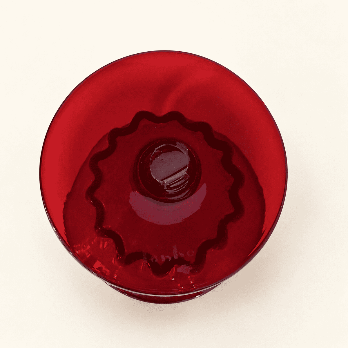 Foot of the Blenko ruby compote seen through the bowl from above
