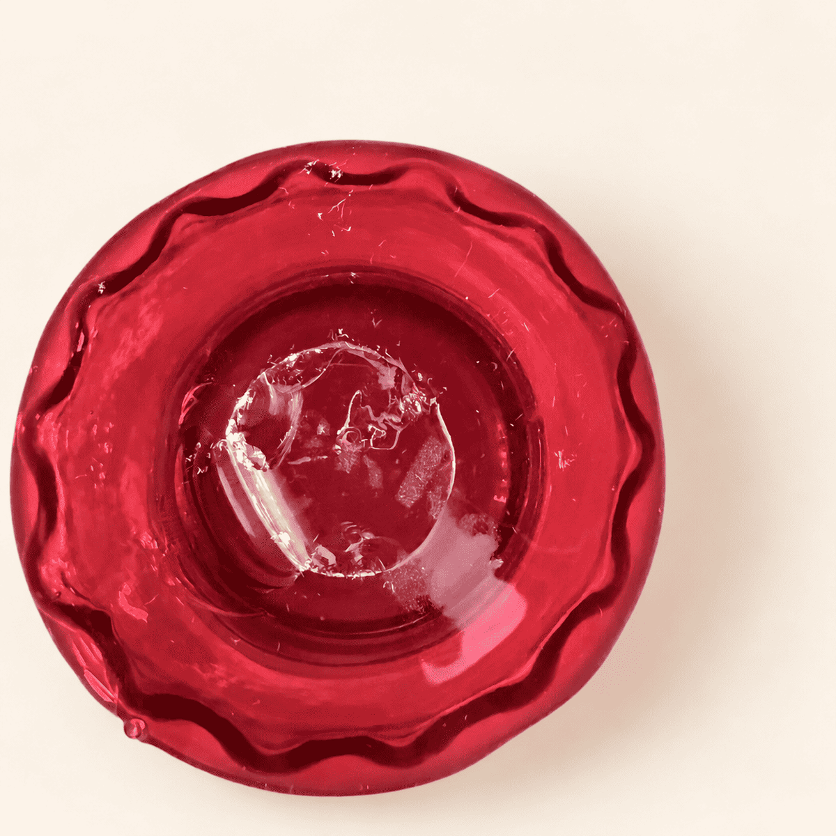 Rough pontil on the underside of the Blenko ruby compote foot