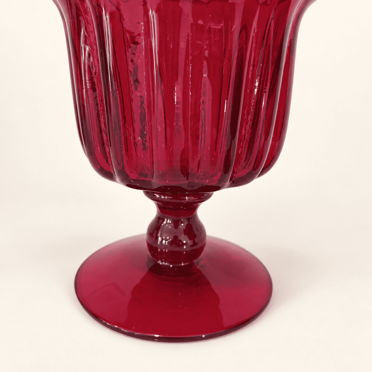 Ribbed bowl, knop stem, and round foot of a Blenko ruby compote