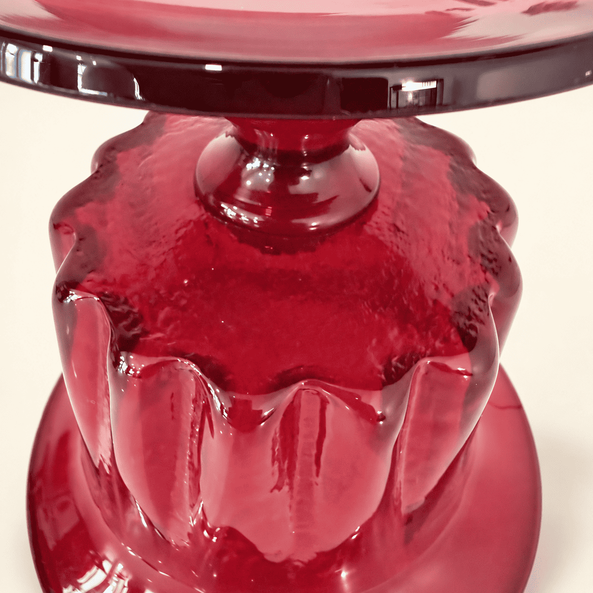Underside of the ribbed bowl and knop stem on a Blenko ruby compote