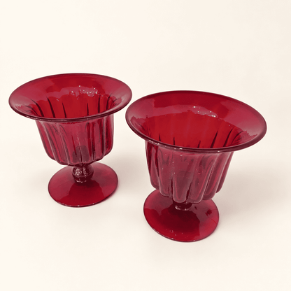 Pair of Blenko ruby ribbed compotes viewed from above at an angle