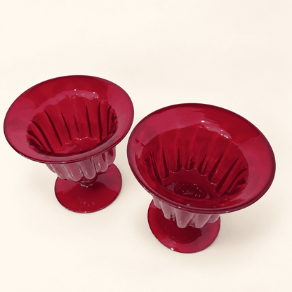Pair of Blenko ruby compotes from above, showing the ribbed bowls and flared rims