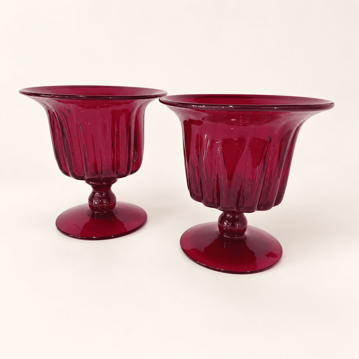 Pair of Blenko ruby ribbed footed compotes, front view