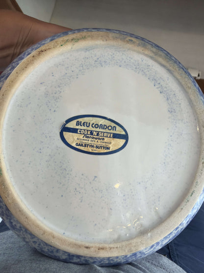 Blue sponged stoneware casserole showing the domed lid and lug handles