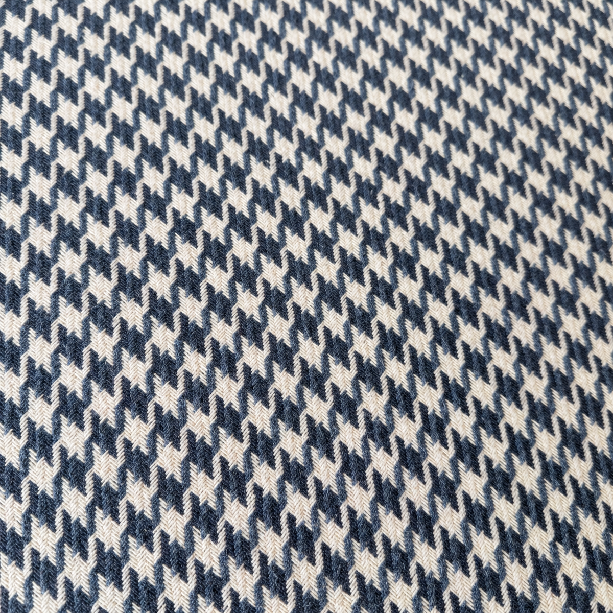 Houndstooth upholstered ottoman side profile