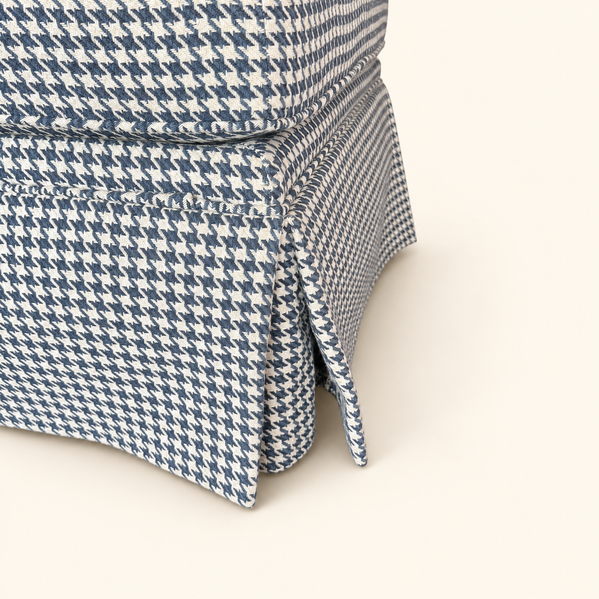 Blue houndstooth footstool with kick-pleat skirt
