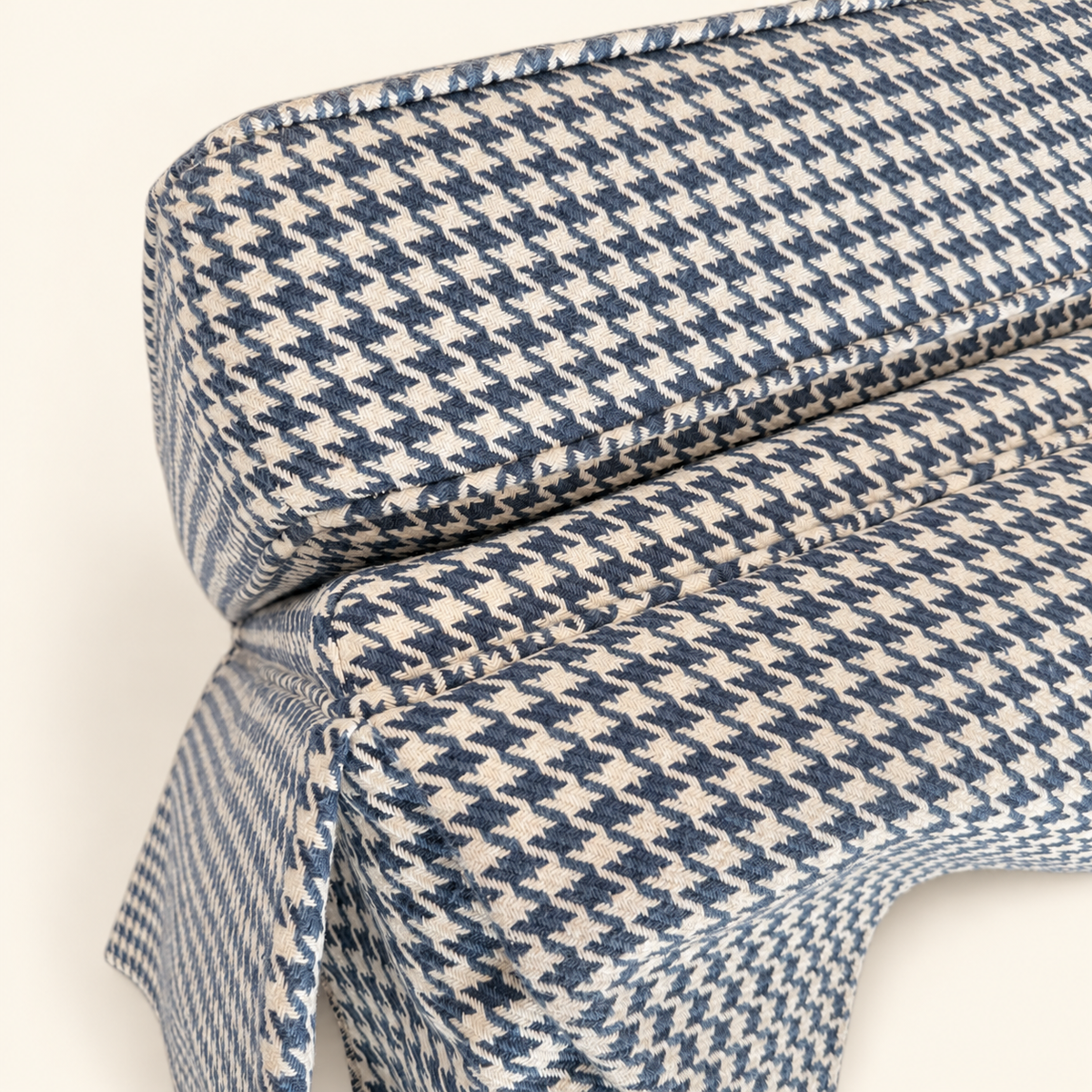 Blue houndstooth ottoman styled in a living room