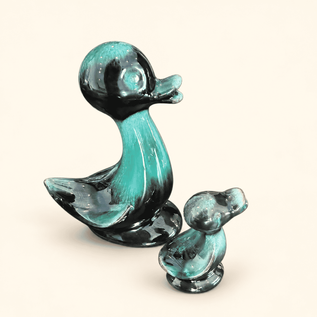 Blue Mountain Pottery teal duck figurines, side view