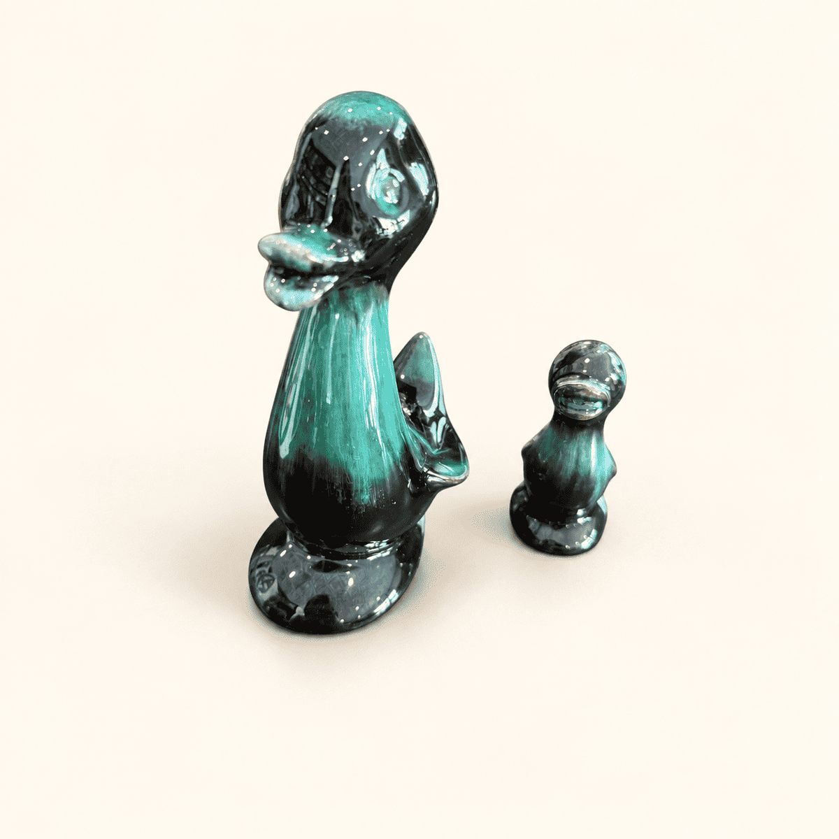 Blue Mountain Pottery ceramic duck with glossy teal-black glaze