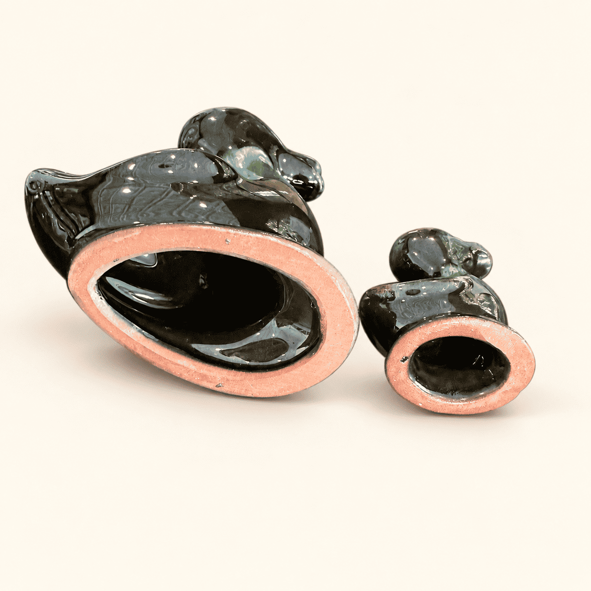 Mid-century Blue Mountain Pottery duck pair on a shelf