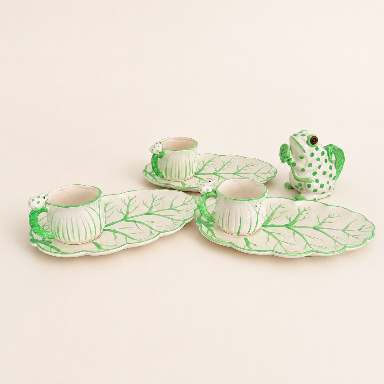 Full hand-painted frog and cabbage-leaf luncheon set arranged together