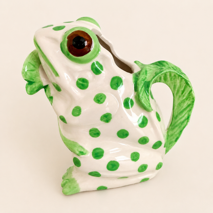 Angled view of Café Italiano frog creamer with leaf handle