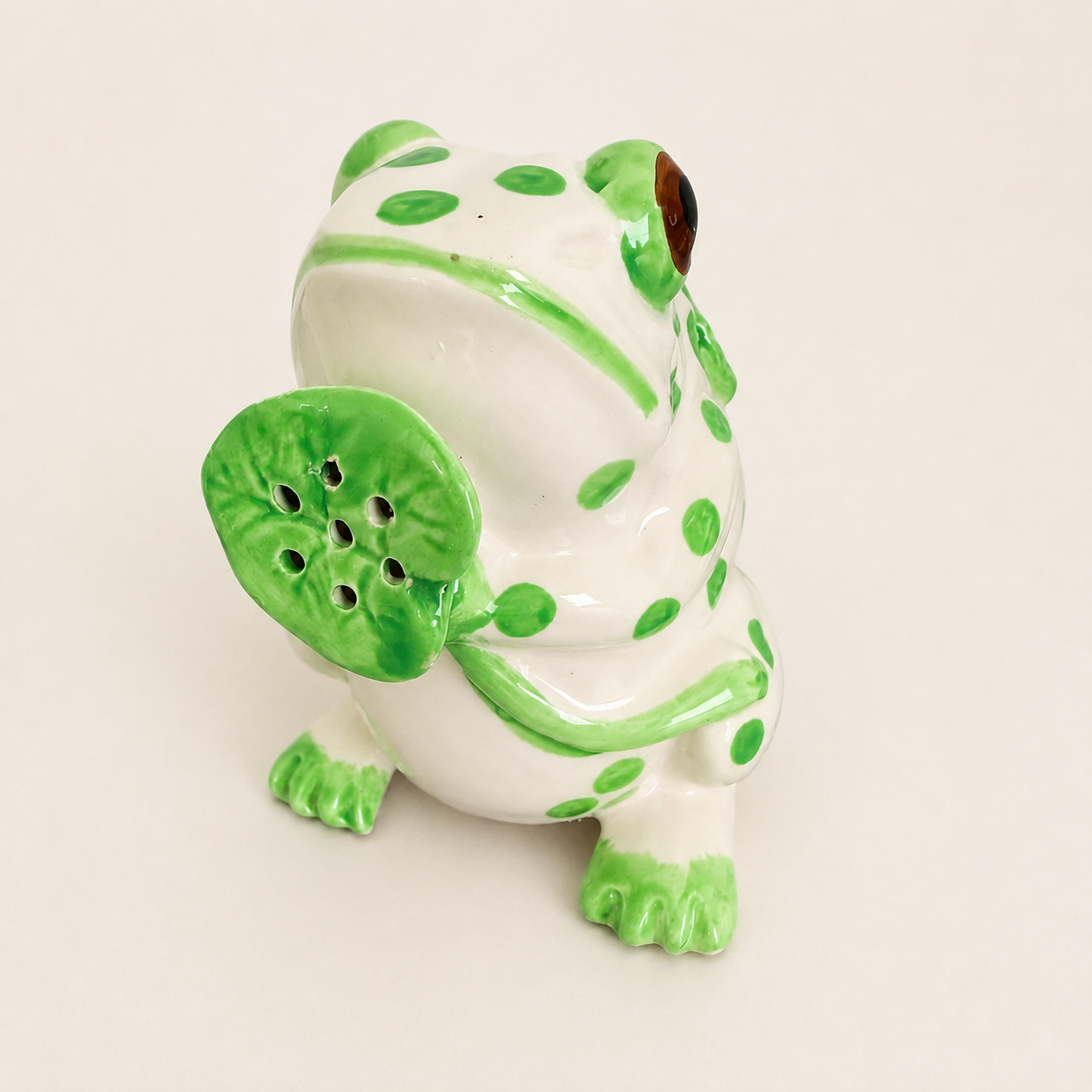 Frog creamer showing lily-pad spout and green spots