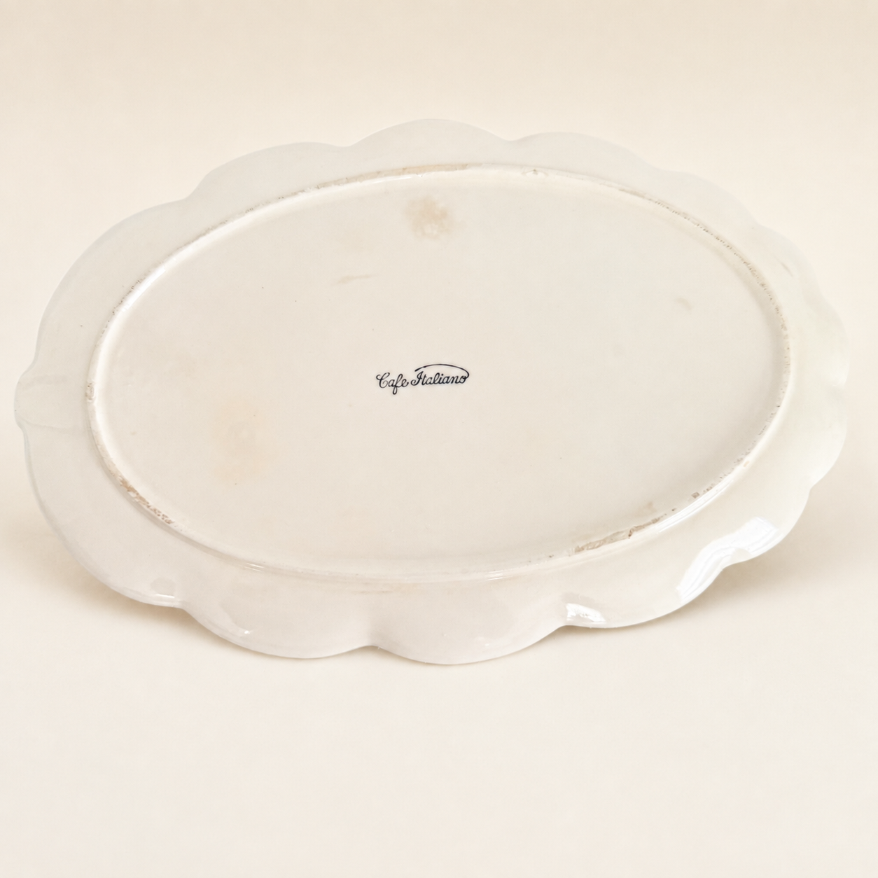 Underside of leaf plate showing "Café Italiano" mark
