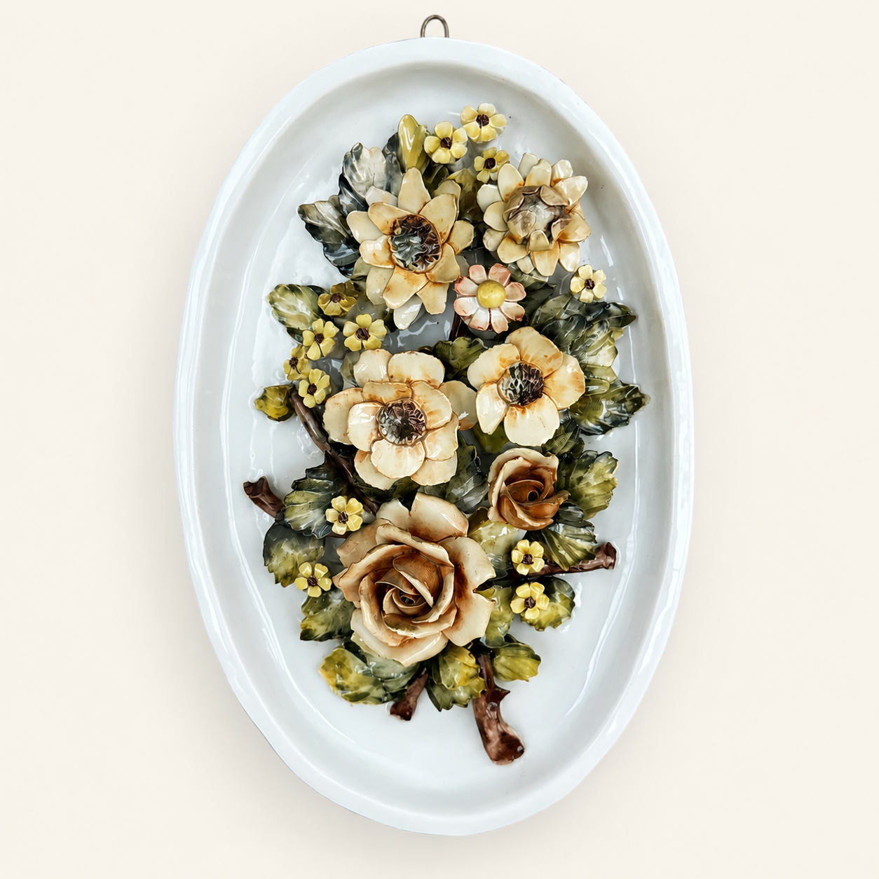 Capodimonte-style ceramic wall plaque with applied roses and flowers, front view