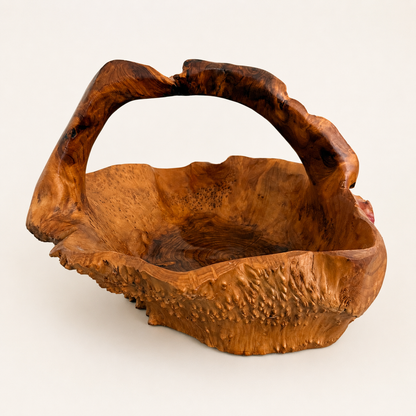 Side view of rootwood basket showing arched natural handle