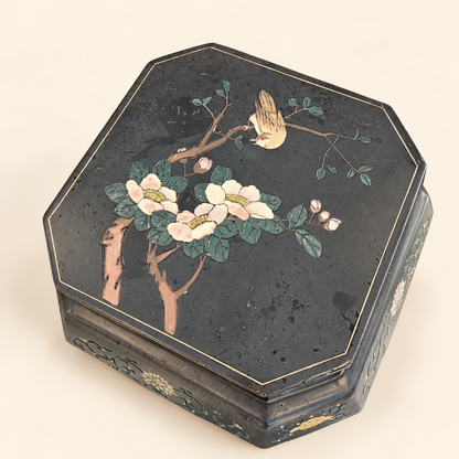 Hand-painted floral spray on black lacquer stool top