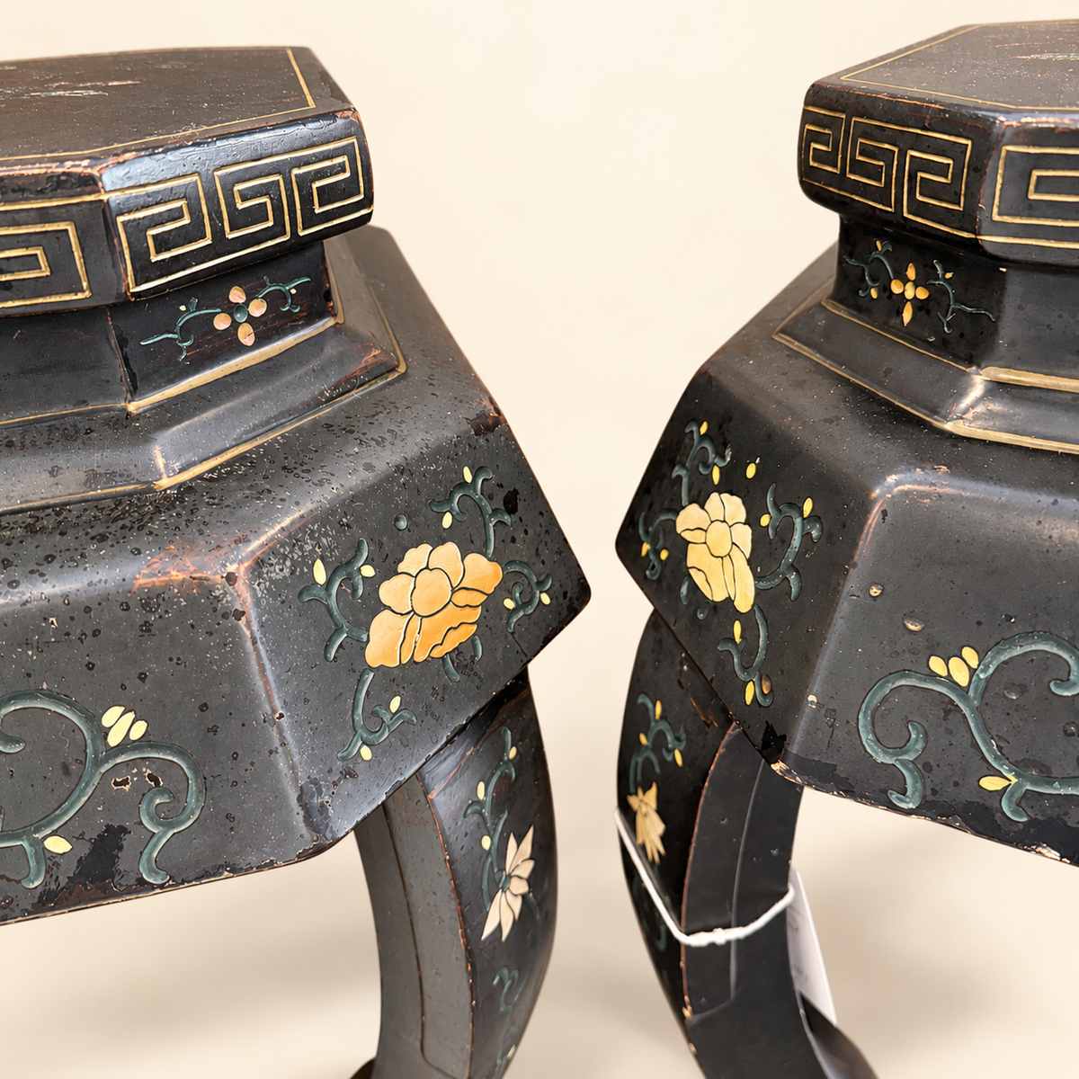 Canted painted panels and bowed legs of lacquer stool