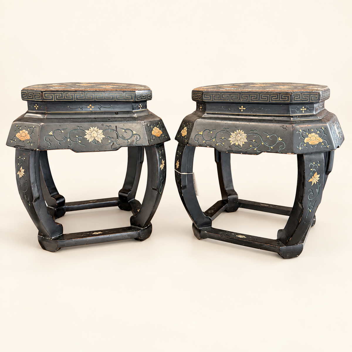 Pair of Chinese black lacquered hexagonal stools with painted florals