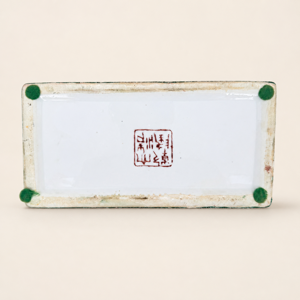 Base of porcelain box with red seal mark and felt pads